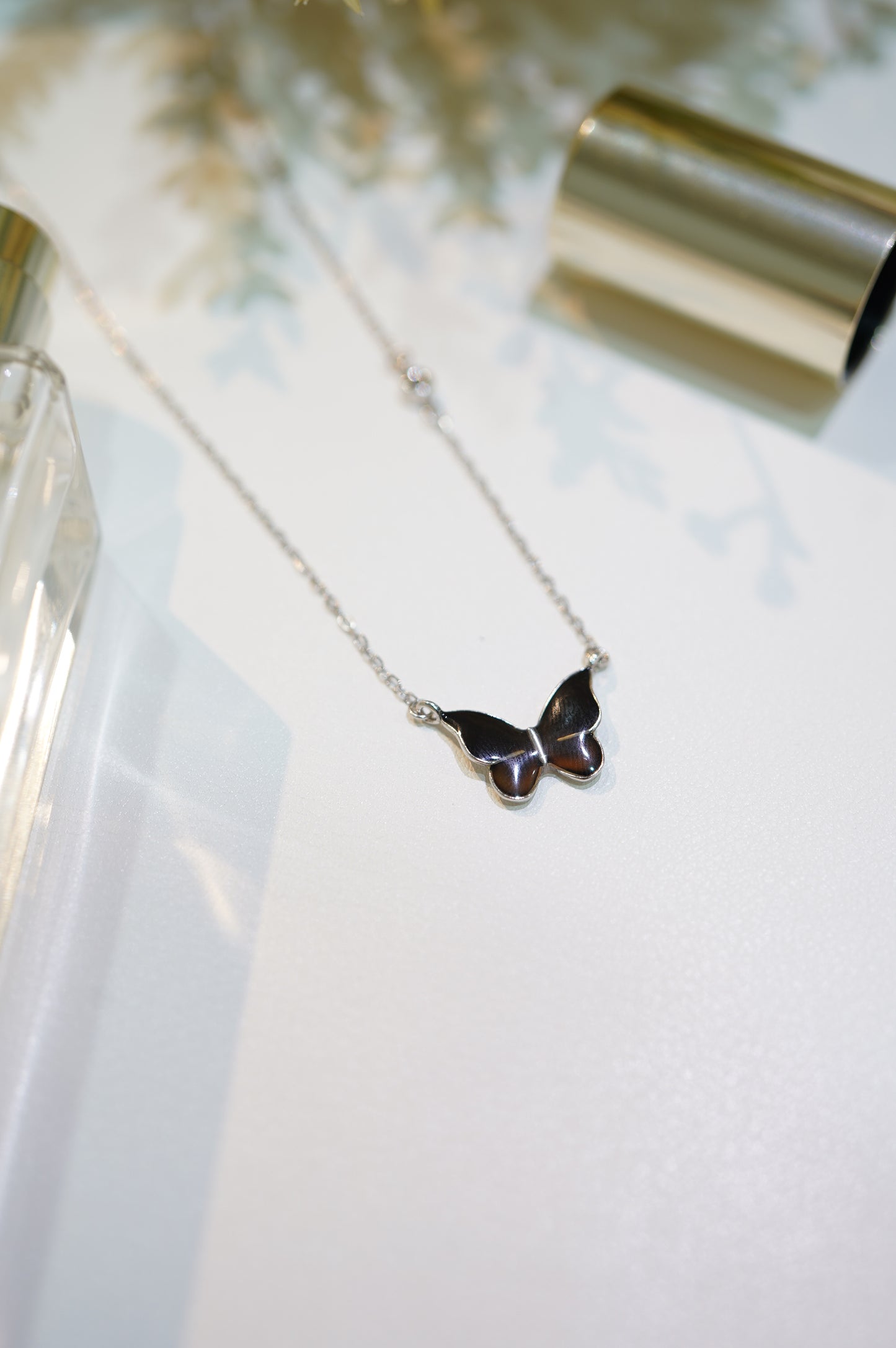 Black Discolored Butterfly Necklace